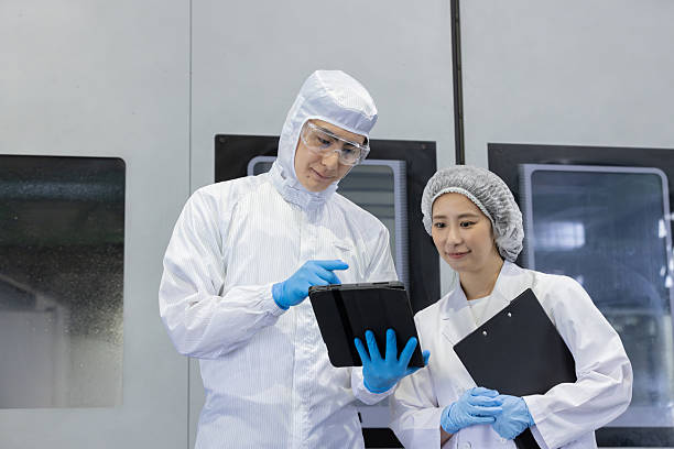 istock Group of Asian workers working in a machining center 2244725351