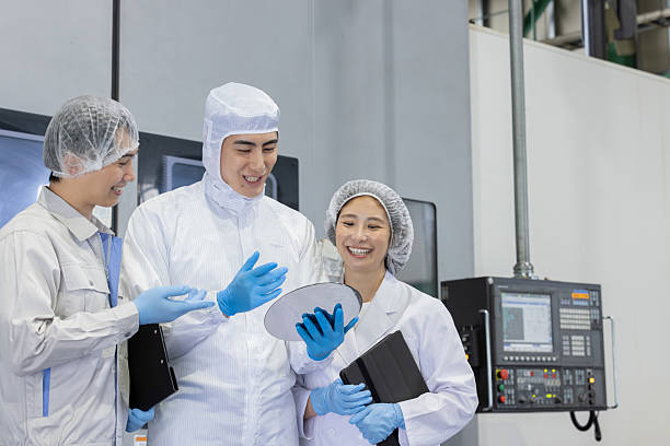 istock Group of Asian people working in a semiconductor factory 2244725573