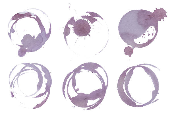 istock Real red wine stains and glass ring marks on white background. Vine glass round stains set. Artistic grape juice spill texture for food and drink design 2244726441
