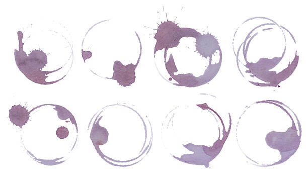istock Round wine stains and glass ring marks on white background. Real red vine glass stains set. Artistic grape juice spill texture for food and drink design 2244726443