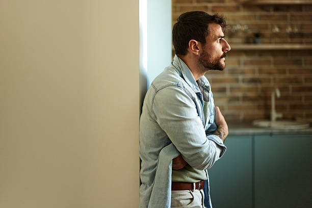 istock Worried man thinking of his problems at home. 2244726520