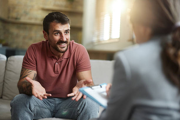 istock Happy man talking to his advisor at home. 2244726692