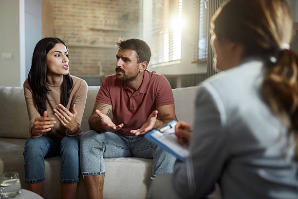 istock Displeased couple having a counseling session with therapist. 2244727072