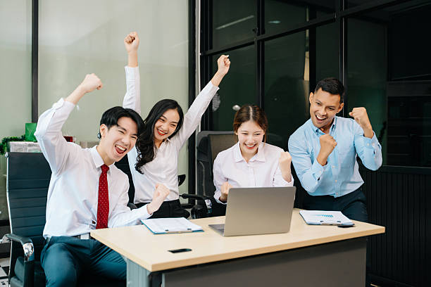 istock Happy businesspeople while collaborating on a new project in an office. Group of diverse businesspeople 2244727521