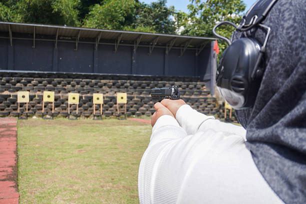 istock Focused Shooter Aiming for Accuracy at Outdoor Target Practice. 2244728211
