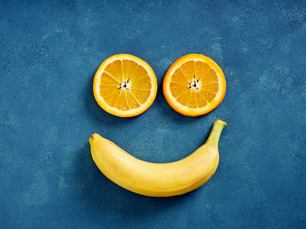 istock Citrus and banana fruit creating happy smiling face 2244728705