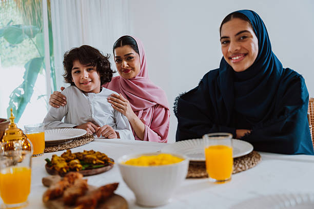 istock Muslim family members playing a game during eid celebration meal 2244729750