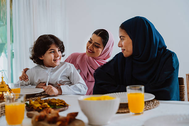 istock Muslim family members playing a game during eid celebration meal 2244729794