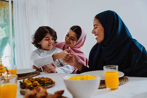 istock Muslim family members playing a game during eid celebration meal 2244729923