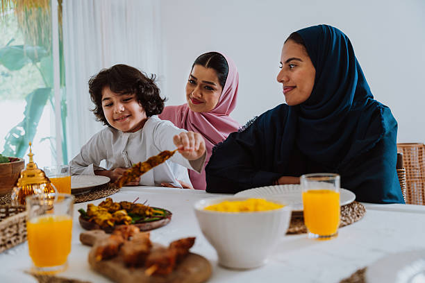 istock Muslim family members playing a game during eid celebration meal 2244729929