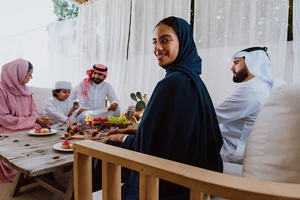 istock Arab family celebrating eid with sweet dessert 2244730885