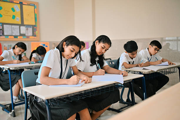 istock Indian school children writing in classroom 2244731371