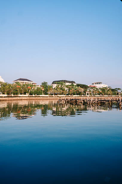 istock Serene Waterfront with Modern Buildings and Calm Reflections 2244732696