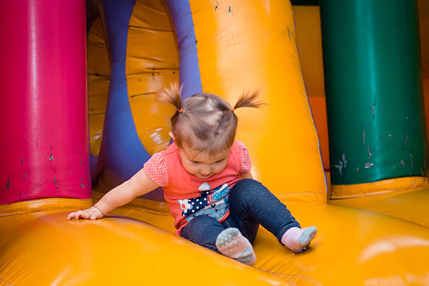 istock Toddler Playing in Colorful Indoor Playground 2244733413