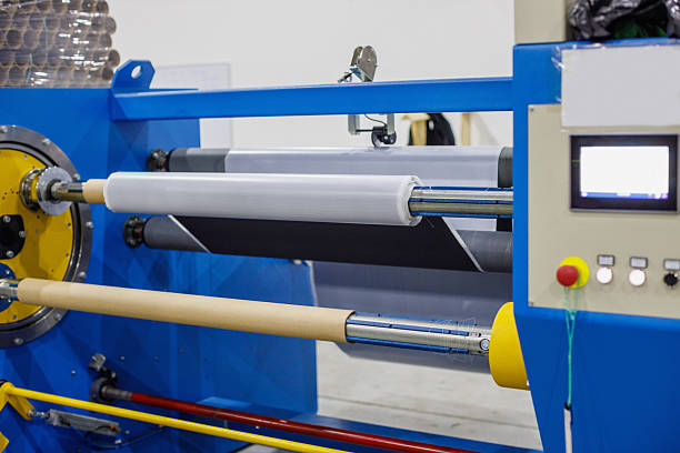 istock Manufacturing machinery on production line with rolls on axis and control panel 2244736830
