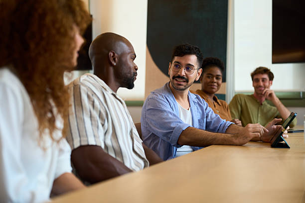 istock Diverse business team collaborating in office meeting 2244737328