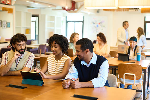 istock Diverse business professionals collaborating in modern coworking office 2244737359