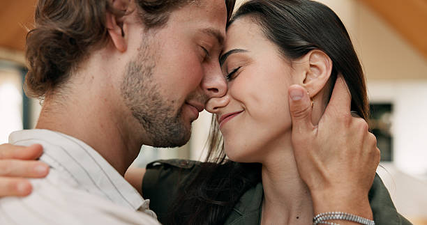 istock Happy, couple and embrace in home, love and people with commitment, care and affection in apartment. Man, smile and bonding with woman on anniversary, romance and relationship milestone in house 2244738445