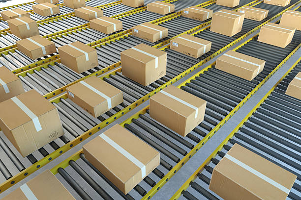 Cardboard Boxes Moving on a Yellow Conveyor Belt in a Warehouse. 3D Render