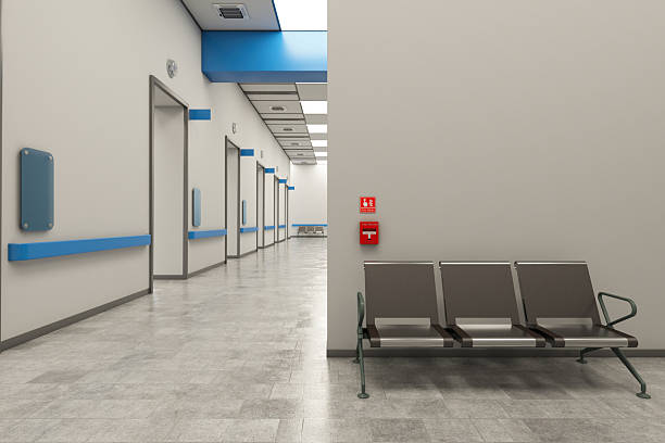 Empty Hospital Corridor Waiting Area with Chairs and Fire Alarm System. 3D Render