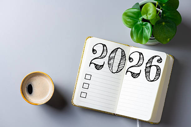 istock New year resolutions 2026 on desk. 2026 goals list with notebook, coffee cup, plant on table. Resolutions, plan, goals, action, checklist, idea concept. New Year 2026 resolutions 2244740098