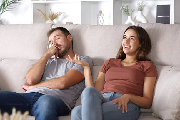 istock Bored man listening his partner at home 2244740797