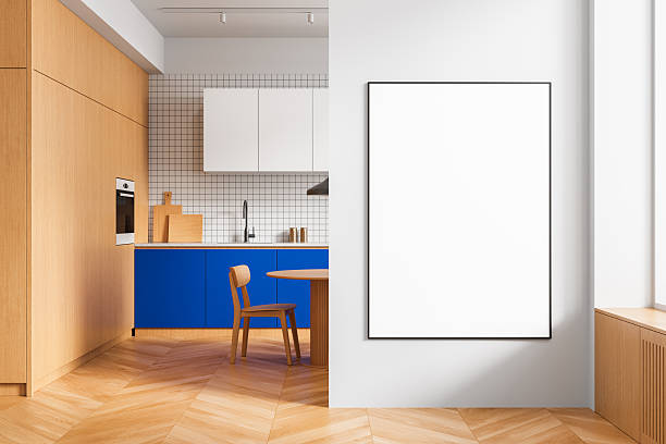 istock Modern kitchen interior with wooden and blue cabinetry and empty wall poster mockup for design presentation on white background wall surface template. 3D Rendering 2244741075
