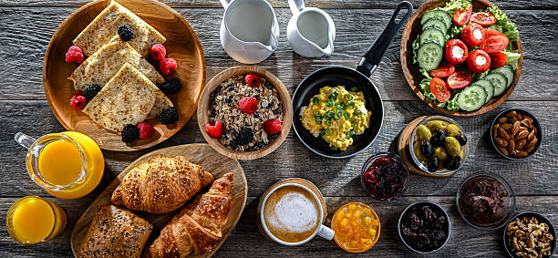 istock Breakfast served with coffee, eggs, cereals and croissants 2244741539