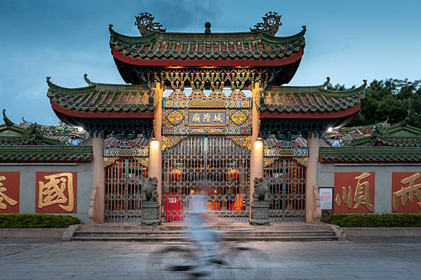 istock Blurred biker in front of Buddhist temple in Jieyang 2244742452