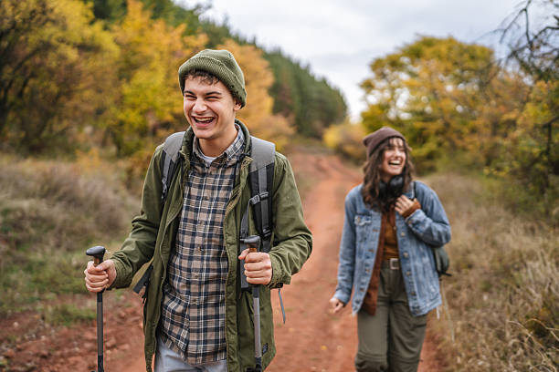 istock Smiling couple hiking forest trail during autumn 2244742976