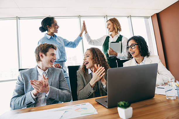 istock Professional business team collaborating in a modern office space focusing on teamwork and idea sharing for project success. 2244743811