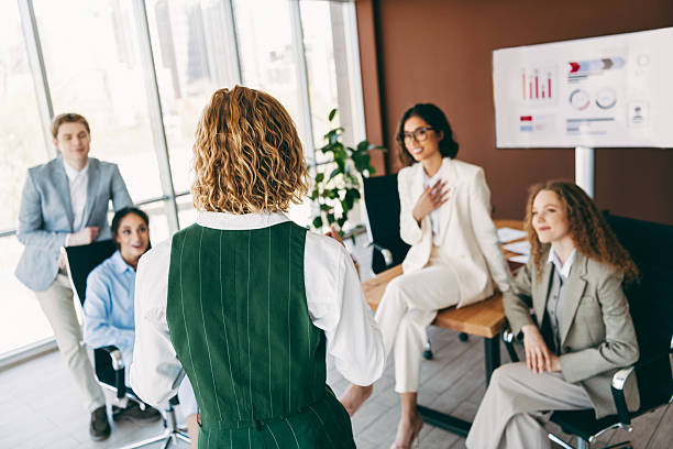 istock Professional team collaborating during an office meeting showcasing teamwork, with charts and presentations 2244743885