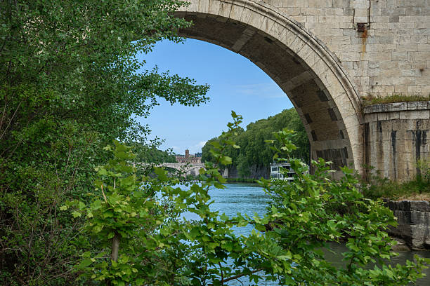 View through the arch of the old bridge in Rome.