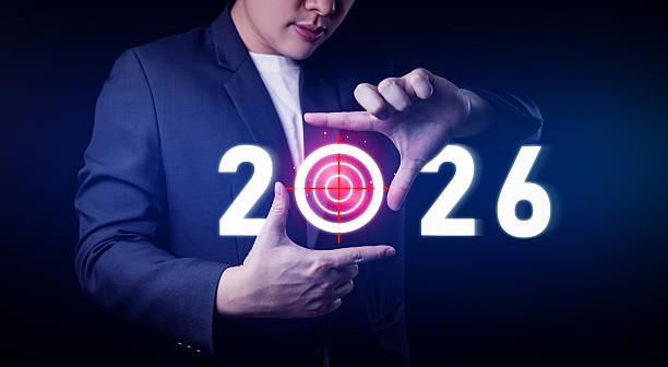 istock New Year's goal setting concept. Businessman creates focus frame with year number 2026. 2244746553