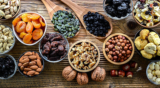 istock Composition with a variety of dried fruits and assorted nuts. 2244747604