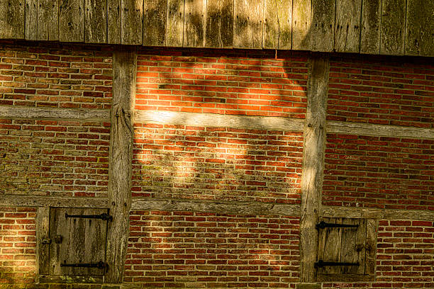 Half timbered wall detail on the Bels Watermill and Mosbeek stream during a beautiful fall day in the Twente region in Overijssel, The Netherlands.
