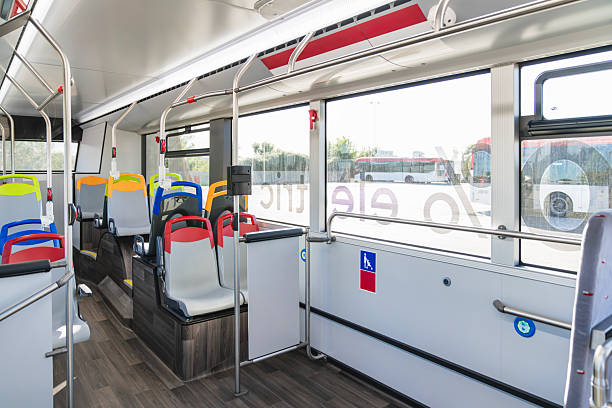 istock Empty city bus interior showing colorful seats and accessibility 2244749339