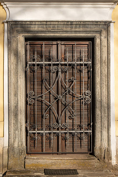 istock An old door locked behind a closed decorative lattice 2244749409
