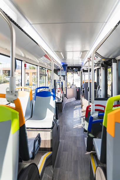 istock Empty modern city bus interior with colorful seats 2244749695