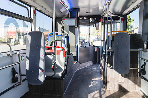 istock Empty modern city bus interior with rows of seats 2244749739