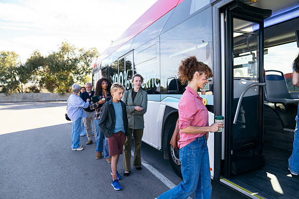 istock Diverse passengers boarding modern electric city bus 2244750616
