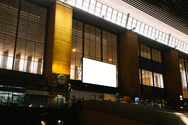 A blank billboard inside a railroad station