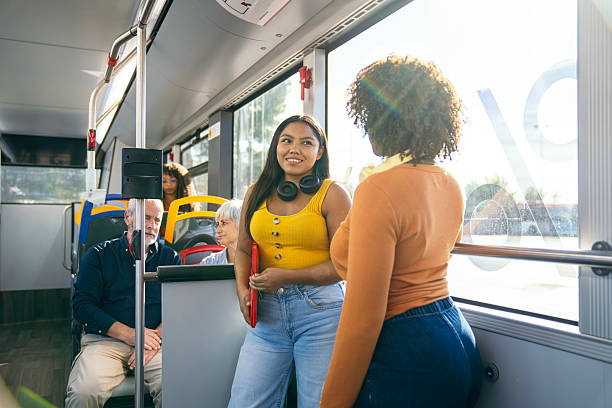 istock Diverse people commuting on city bus having conversation 2244752174