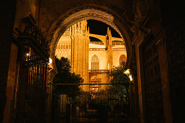 The beautiful exterior facade of Seville cathedral at night