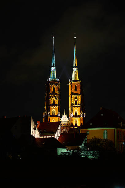 istock Illuminated cathedral towers at night in cityscape 2244752690