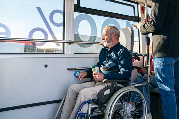 istock Senior man with disability riding city bus 2244755518