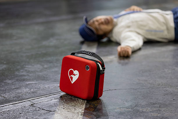 Asian worker injured and collapsed in factory (rescue training)