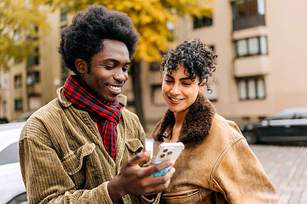 istock Multiracial couple using a smartphone outdoors 2244757851