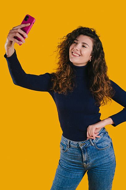 istock Animated female influencer strikes happy pose for camera 2244760979