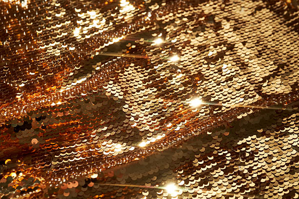 istock Abstract festive gold background made of sequins. 2244761191